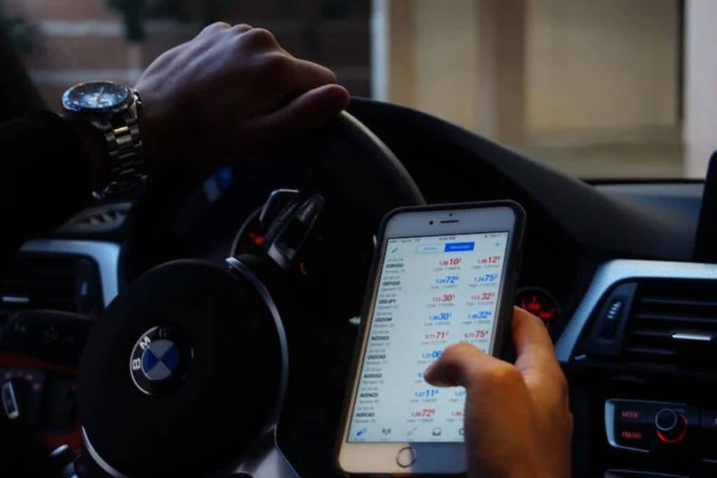 Man viewing stock market on the go using trading psychology - TradeZella