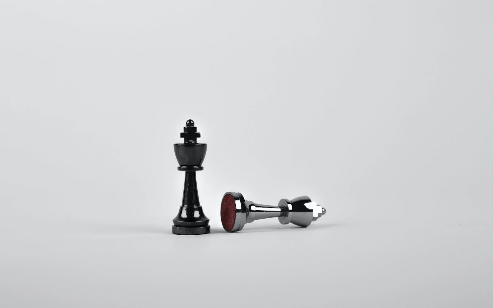 Chess pieces with the black king checking the white king- TradeZella